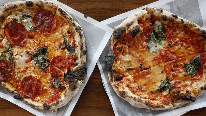 The Enquirer/Cara Owsley
The Diavola, left, a red pizza with smoked mozzarella, pepperoni, basil and chili flake; and the Margherita at Pizzeria Locale.
The Diavola, a red pizza with smoked mozzarella, pepperoni, basil and chili flake by Pizzeria Locale at 7800 Montgomery Road in Kenwood.