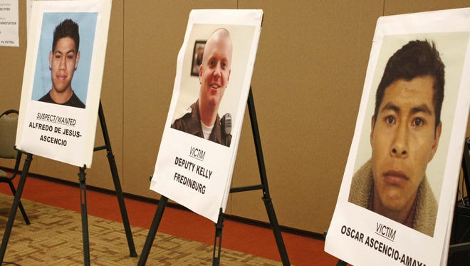 A poster of Alfredo De Jesus- Ascencio (left) who is wanted in the 2007 deaths of Marion County Deputy Sheriff Kelly Fredinburg (center) and Oscar Ascencio-Amaya
