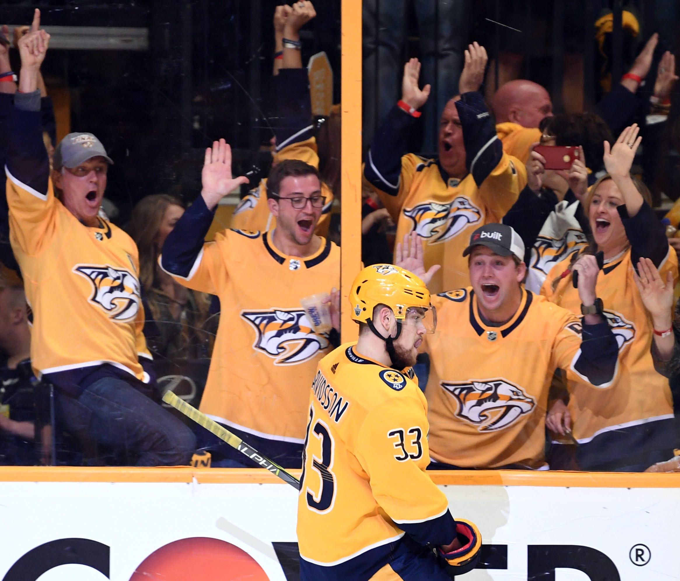 Nashville Predators fans celebrate after a goal by left wing Viktor Arvidsson during the second period Sunday night.