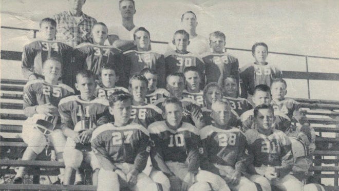 John Holmes, back row right, was a legendary youth coach and organizer who died recently at age 88. His brother is the person for whom Holmes Regional Medical Center in Melbourne is named.