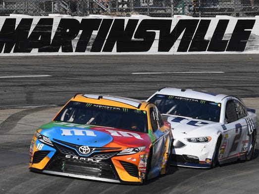 Kyle Busch (18) leads eventual winner Brad Keselowski