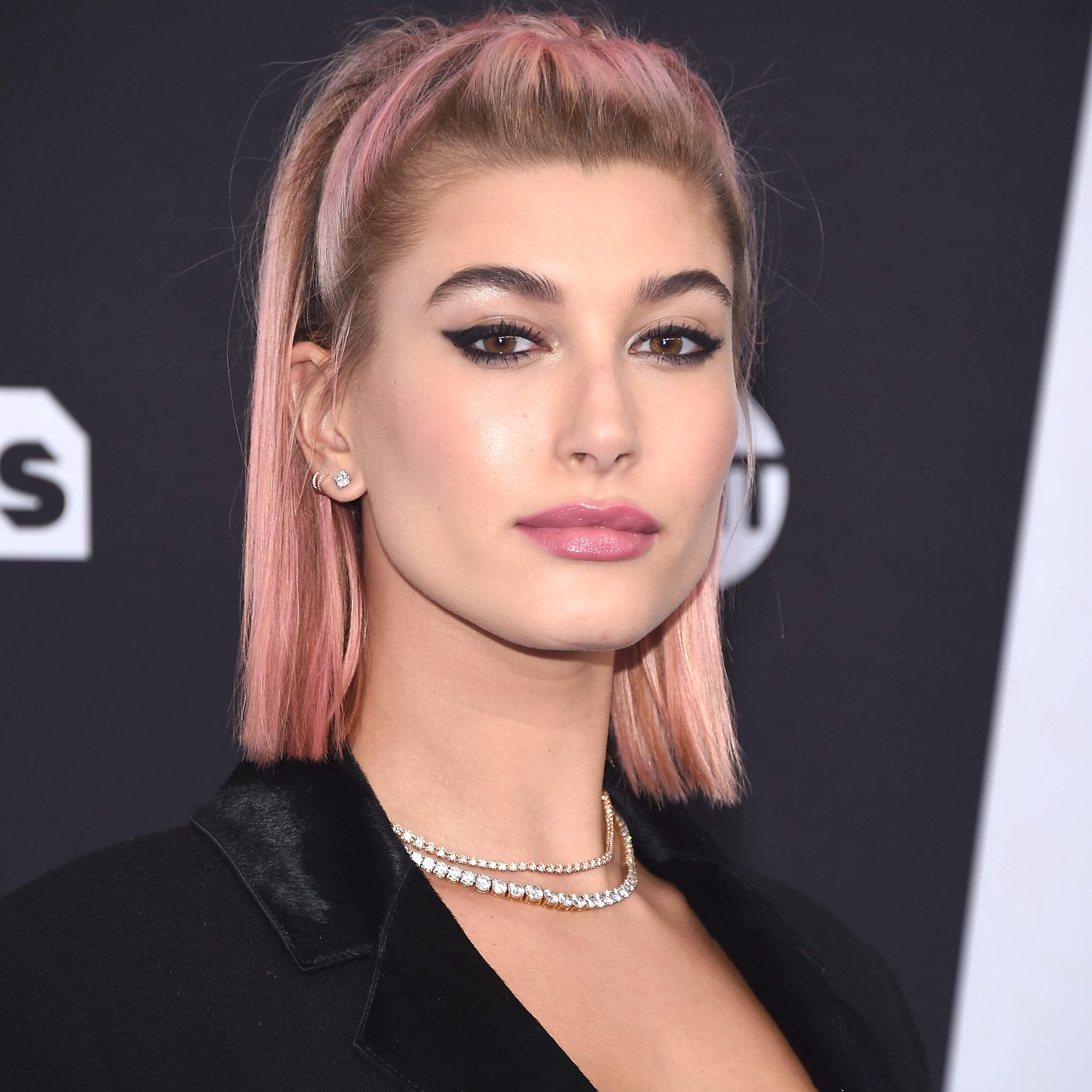 Trend: Pink pucker. Hailey Baldwin attended the 2018 Turner Upfront on May 16, 2018 in New York with a pink-hued pout.