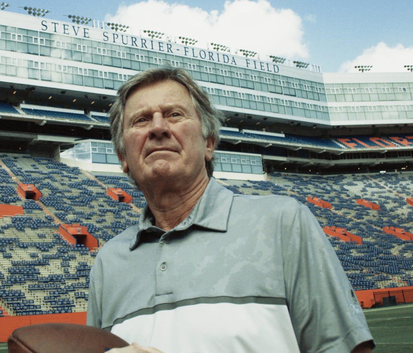 Steve Spurrier stands on the football field at University of Florida, named after him for his achievements as a player and a coach.
