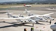 The Virgin Galactic spaceship sits on a runway at