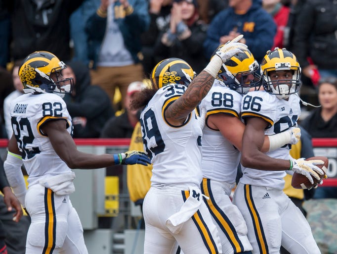 From left, Michigan's Amara Darboh, Sione Houma, Jake
