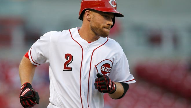 Cincinnati Reds shortstop Zack Cozart (2) rounds the bases after hitting a solo home run in the bottom of the third inning of the MLB National League game between the Cincinnati Reds and the Arizona Diamondbacks at Great American Ball Park in downtown Cincinnati on Wednesday, July 19, 2017.