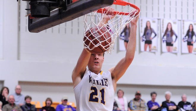 Wylie's Dylan Isenhower finishes a slam dunk against Snyder on Friday, Jan. 12, 2018 at Bulldog Gym.