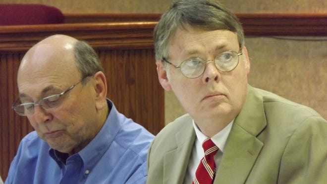 Springfield City Manager Paul Nutting sits alongside former Mayor Billy Paul Carneal.