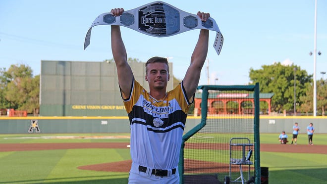 Garrett Kocis holds up his Championship Belt for winning the 2020 Sunflower Collegiate League Home Run Derby. He hit 10 home runs, beating Cheney's Jackson Glenn's nine home runs