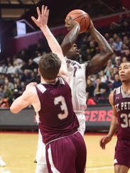 Don Bosco #1 Marcellus Earlington in the paint during