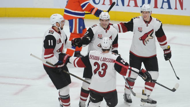 Nov 27, 2016: Arizona Coyotes center Martin Hanzal (11) along with Coyotes right winger Radim Vrbata (17) Coyotes defenceman Connor Murphy (5) and Coyotes defenceman Oliver Ekman-Larsson (23) celebrate their goal against Edmonton Oilers goalie Cam Talbot (33) during the first period at Rogers Place.