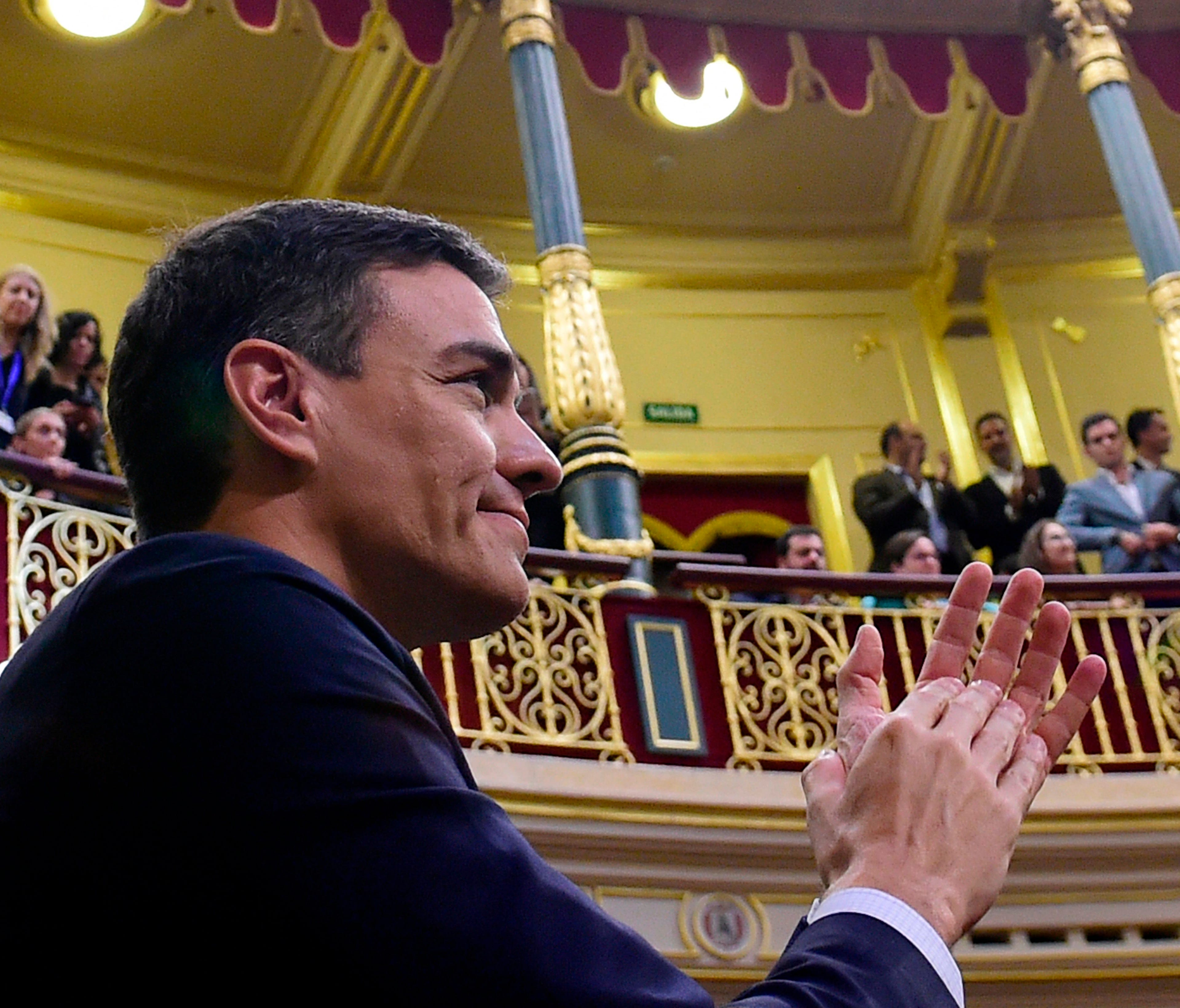 Spain's new Prime Minister Pedro Sanchez acknowledges applause after a vote on a no-confidence motion at the Lower House of the Spanish Parliament in Madrid on June 1, 2018.