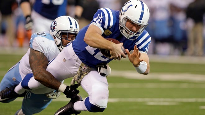 Indianapolis Colts quarterback Andrew Luck (12) is tackled by Tennessee Titans defensive tackle Jurrell Casey (99) during the first half in Indianapolis, Sunday.