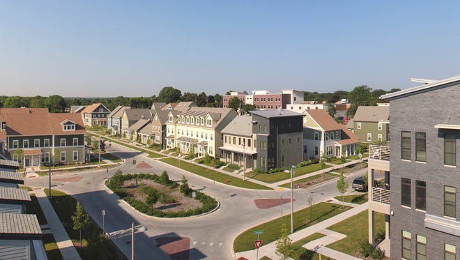 The redevelopment of Westlawn Gardens features mid-rise apartment buildings, townhouse-style units and a new street grid.