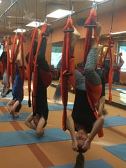 Exercise in the air with Trapeze Yoga