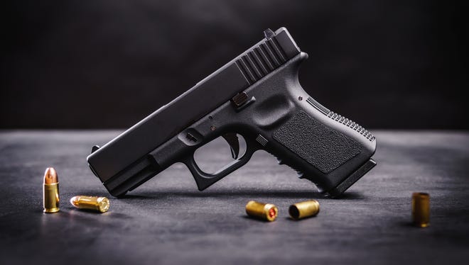 A convicted felon has been sentenced to 15 years in federal prison for possessing a 9mm handgun, similar to this one.
