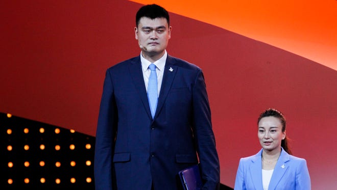 Retired Chinese professional basketball player Yao Ming (L) and two time Olympic champion in short track, Yang Yang (R) during the Presentations by the Candidate Cities for the Third Winter Youth Olympic Games in 2020, at the Convention Centre in Kuala Lumpur, Malaysia, on July 31, 2015.
