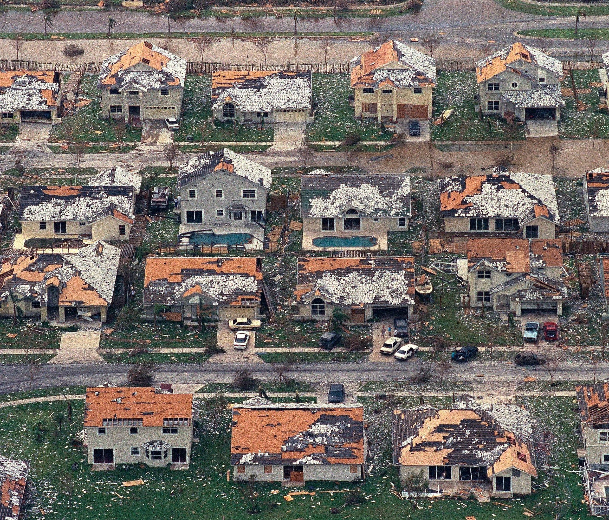 This Aug. 25, 1992 file photo shows rows of damaged houses between Homestead and Florida City, Fla.