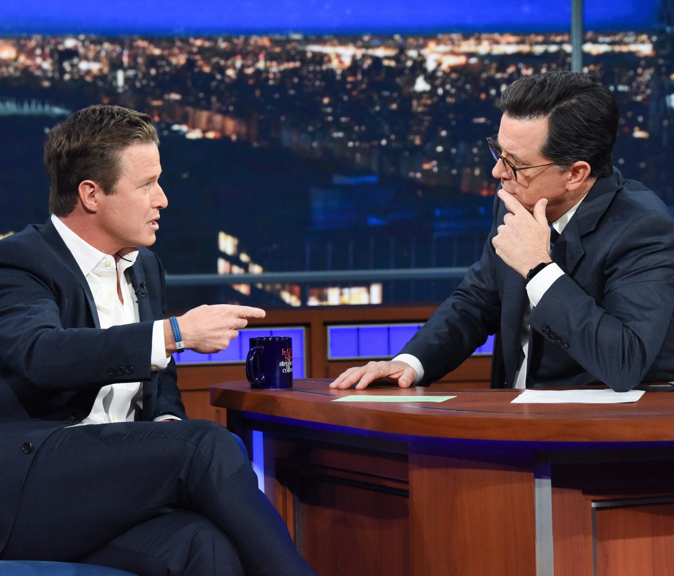 Former 'Access Hollywood' and 'Today' host Billy Bush, left, talks to Stephen Colbert Monday on CBS' 'The Late Show.'