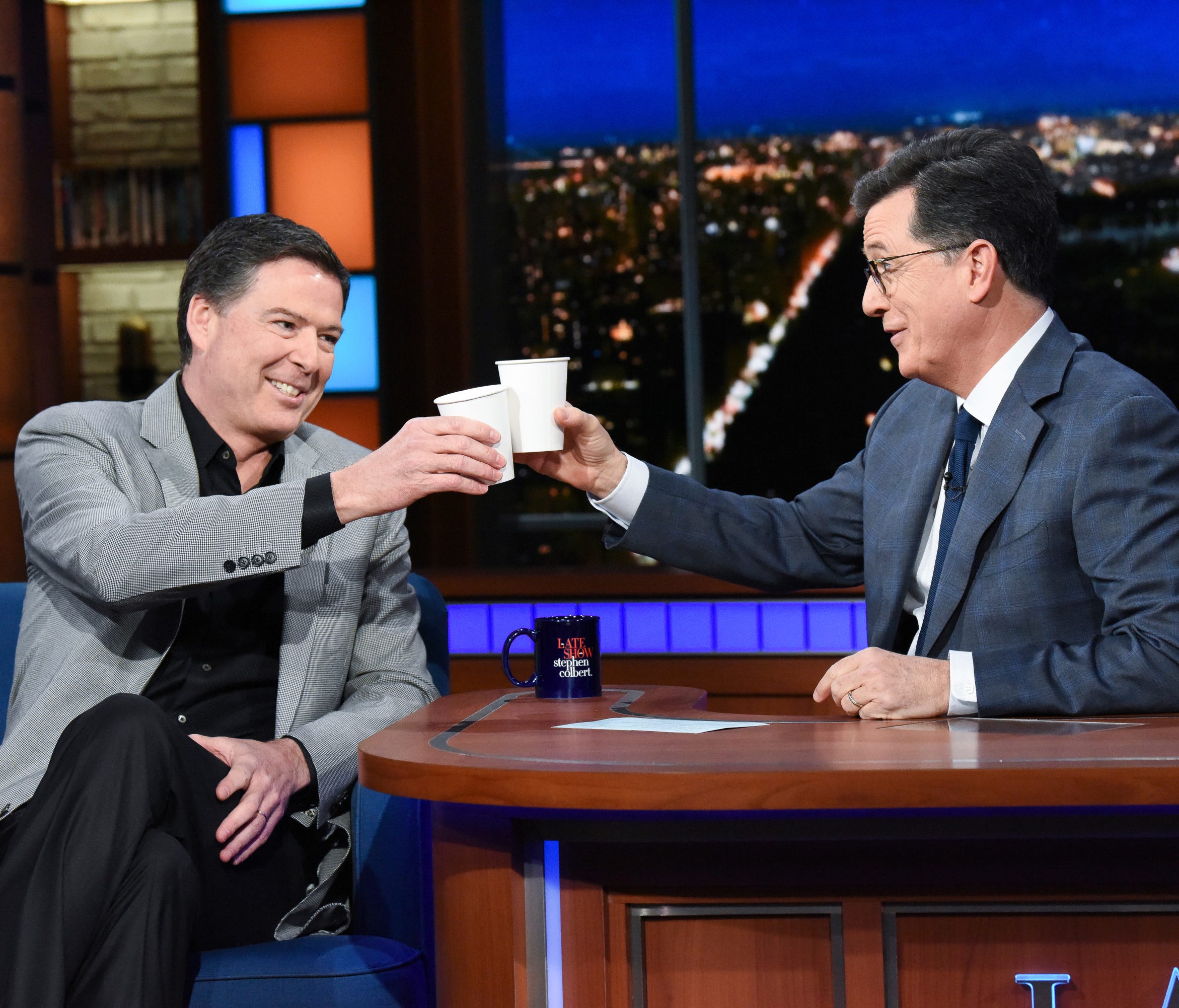 Former FBI director James Comey (left) with host Stephen Colbert (right) on 
