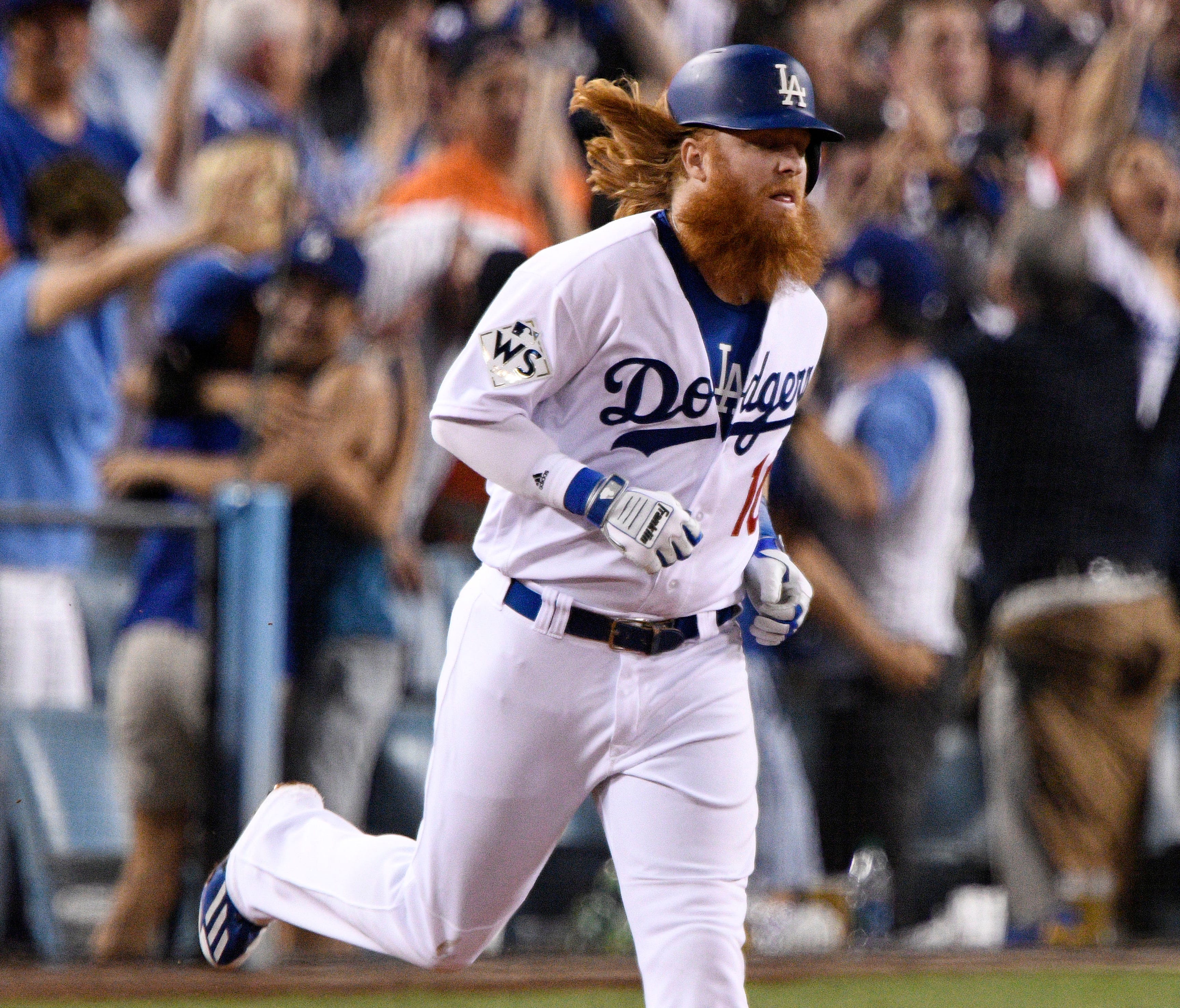 Justin Turner rounds the bases after a two-run homer in the sixth inning.