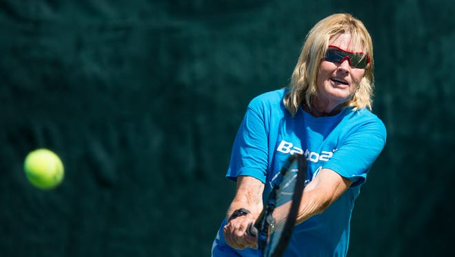 Sherri Bronson, 61, practices with her husband Peter Bronson at Camelback Village Racquet & Health Club in Scottsdale, AZ, on Tuesday, July 7, 2015. Bronson was the captain of team USA when they won the Alice Marble Cup this June in France.
