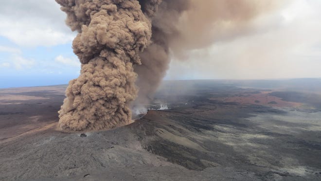 This Friday, May 4, 2018, aerial image released by the U.S. Geological Survey, at 12:46 p.m. HST, a column of robust, reddish-brown ash plume occurred after a magnitude 6.9 South Flank of KÄ«lauea earthquake shook the Big Island of Hawaii, Hawaii. The Kilauea volcano sent more lava into Hawaii communities Friday, a day after forcing more than 1,500 people to flee from their mountainside homes, and authorities detected high levels of sulfur gas that could threaten the elderly and people with breathing problems. (U.S. Geological Survey via AP)