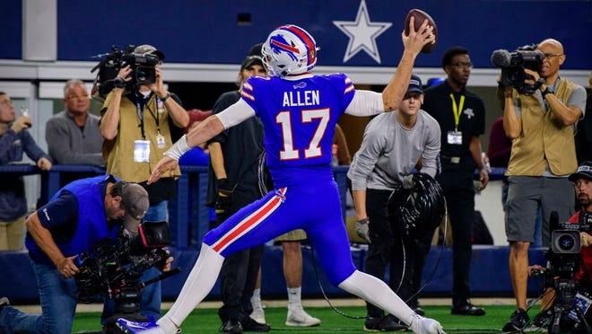 Nov 28, 2019; Arlington, TX, USA; Buffalo Bills quarterback Josh Allen (17) spikes the ball after he runs for a touchdown against the Dallas Cowboys during the game at AT&amp;T Stadium. Mandatory Credit: Jerome Miron-USA TODAY Sports