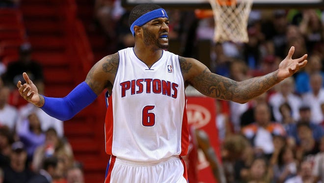 Josh Smith of the Detroit Pistons reacts to a play during a game against the Miami Heat on Dec. 3, 2013, in Miami.