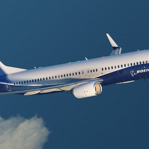 Boeing 737 MAX aircraft on white and blue, airborn