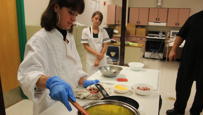 Virgin Valley High School students make ham and cheese omelettes during their culinary arts class. This is the program's first year.