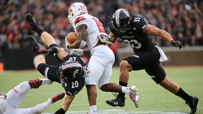 Cincinnati Bearcats safety Carter Jacobs (20) flies in make a tackle in the first quarter during the college football game between the Austin Peay Governors and the Cincinnati Bearcats on Aug. 31 at Nippert Stadium.