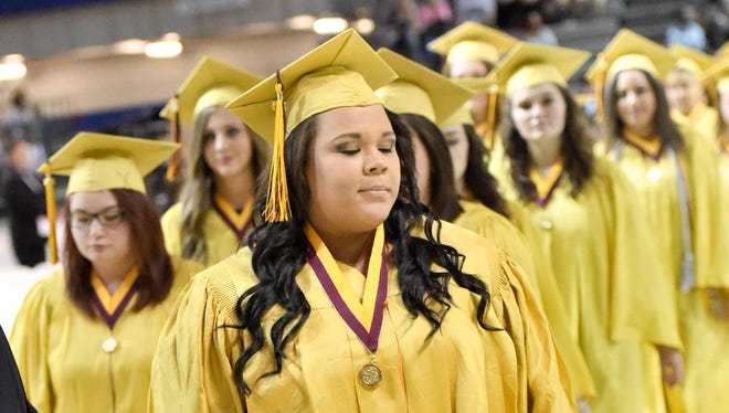 Graduates enter the Knapp Center on Saturday, May 23, 2015, during the Lincoln High School Graduation held at Drake University's Knapp Center.