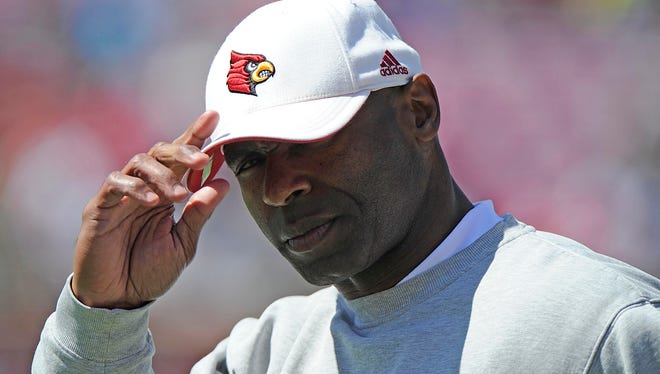 Louisville coach Charlie Strong looks toward the sideline during the Cardinals' spring game at Papa Johns Cardinal Stadium.