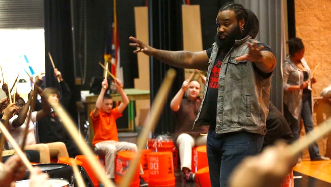 Former member of STOMP, Elec Simon, directs middle schoolers at Mansfield Senior High School on Tuesday, March 22, 2016. The students will host a private performance for family members only on Thursday.