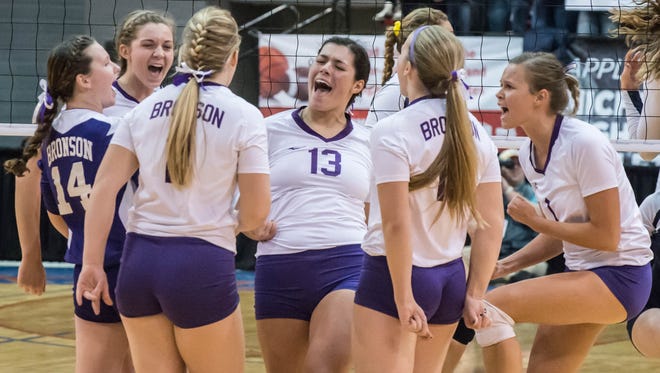 Bronson players celebrate after a point during semifinals against TC St. Francis.