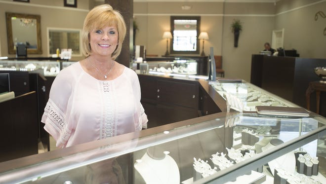 Charlotte Evans stands behind the counter at Charlotte's Jewelry in Montgomery, Ala., on Friday, April 8, 2016. 

charlotte's8