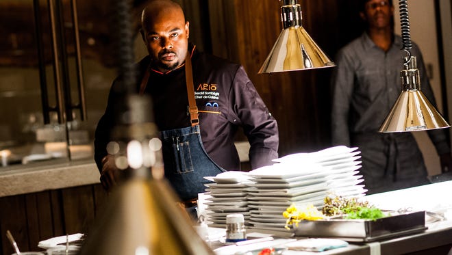 Chef Gerald Sombright watches the kitchen at Ario in the Marco Island Marriott Beach Resort in Marco Island, Fla., on Tuesday, Nov. 8, 2016. Sombright (Chef de Cuisine at Ario) will appear on the upcoming season of the Emmy-winning Bravo hit,"Top Chef."
