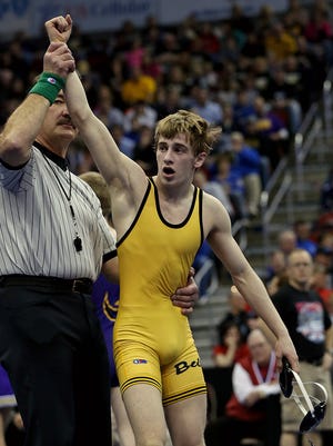 Jacob Schwarm, of Bettendorf, had his arm raised after his win over Henry Pohlmeyer, of Johnston, in their 113 pound championship match in Class 3-A finals at the 2014 Iowa High School state wrestling tournament at Wells Fargo Arena in Des Moines on Saturday night Feb. 22, 2014.