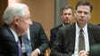 Comey listens to Attorney General Jeff Sessions speak