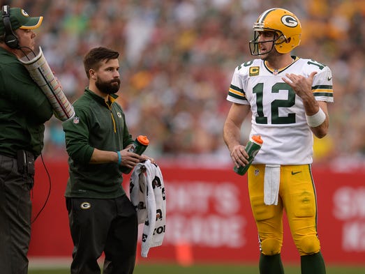 Green Bay Packers quarterback Aaron Rodgers talks to