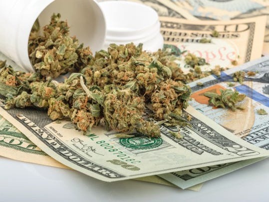 marijuana-on-top-of-money-getty_large_large.jpg