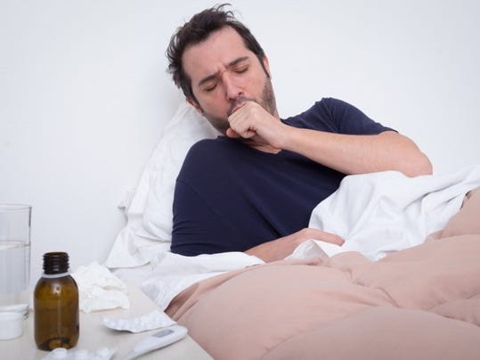 man-sick-in-bed_gettyimages-653442810_large.jpg