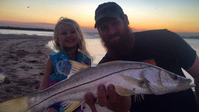 McKenna Klarmann, 4, of Stuart is all smiles after catching and releasing her first two snook Monday while fishing with dad, J.J. Klarmann.