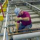 June 2000 File photo of an employee working on the keel of one of two cruise ships at Ingalls Shipbuilding in Pascagoula, Mississippi.