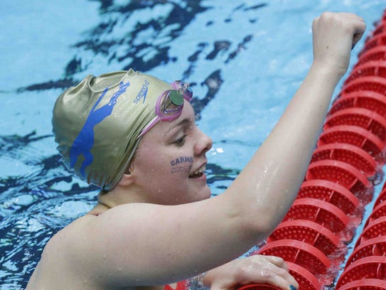 Carmel's Sammie Burchill raises her fist after competing