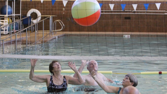 Residents at Royal Oaks Retirement Community in Sun City play water volleyball in Dec. 2015.