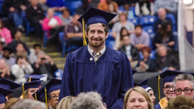 Ken Damphousse at Schoolcraft College's commencement earlier this spring. Damphousse is the first student to graduate with a bachelor's degree from the Livonia-based college.