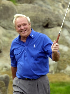 Arnold Palmer waves to the crowd as he walks onto the seventeenth hole of the Arnold Palmer course during the fourth day of the Bob Hope Chrysler Classic at PGA West in La Quinta in 2001.