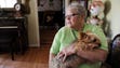 Virginia Clark holds her dog Precious in her Pegram,